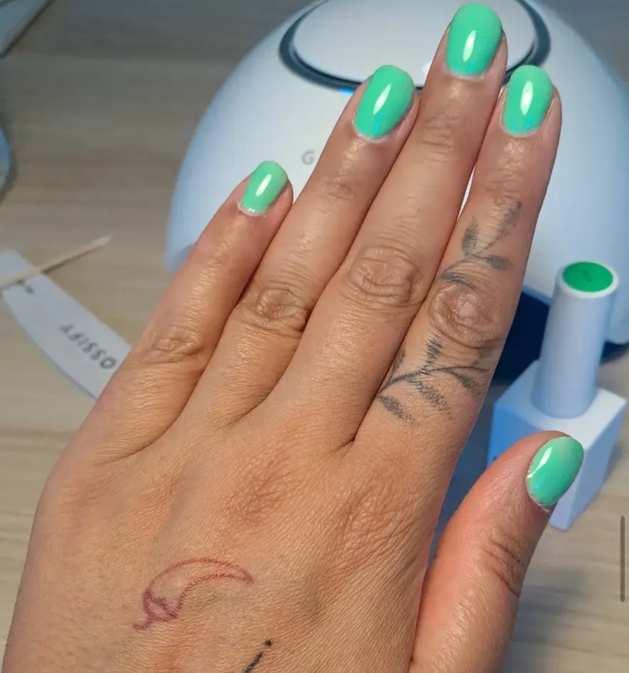 A fresh green set of nails by Painted By Bee, Bal's own nail business